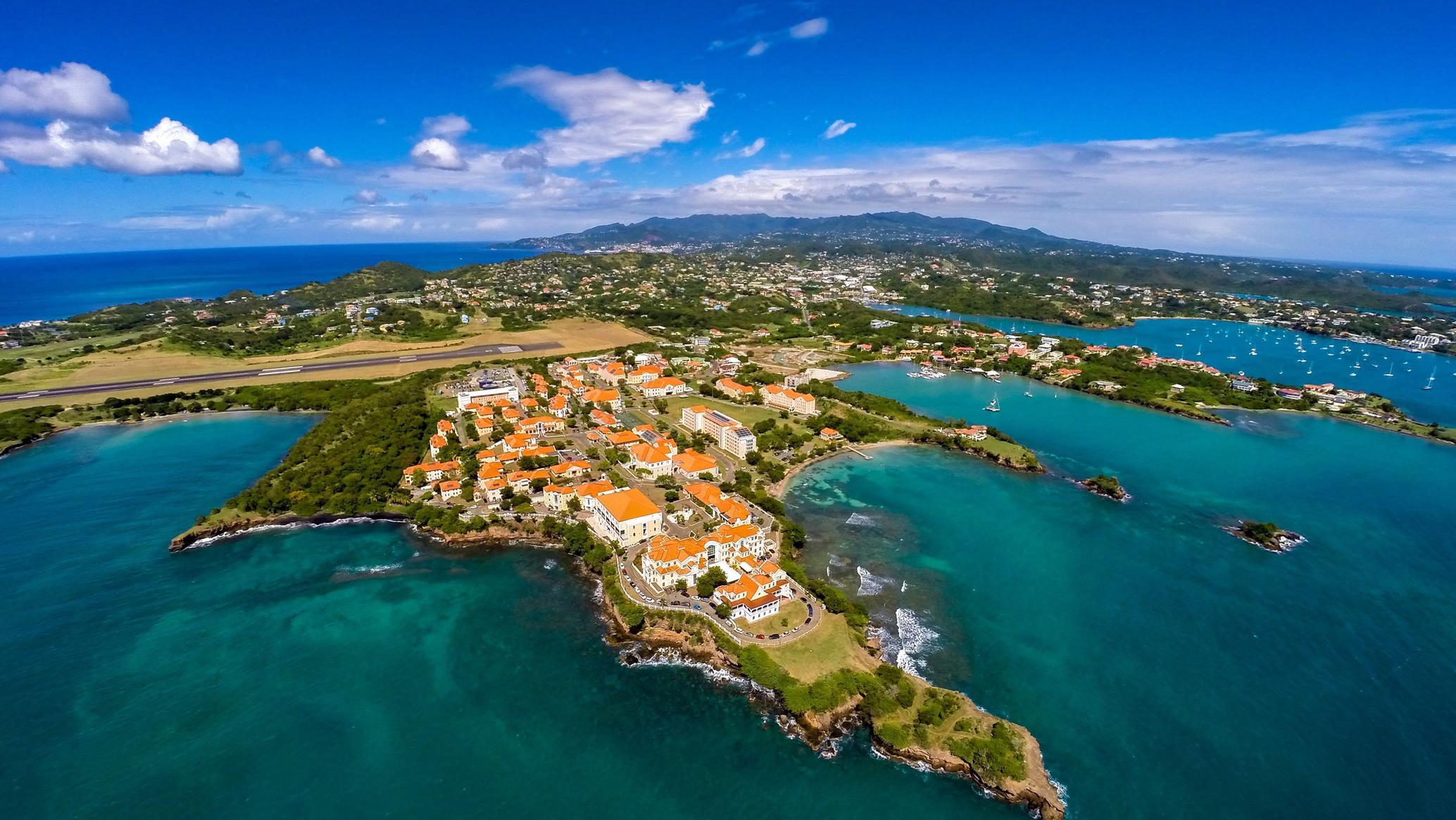 St. George's Harbor in Grenada with colorful buildings and boats