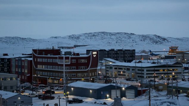 Iqaluit skyline with tundra and mountains in background
