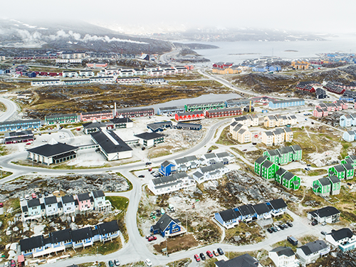 Nuuk, Greenland's capital city showing colorful buildings against mountainous backdrop