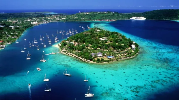 Port Vila harbor with waterfront properties and clear blue water