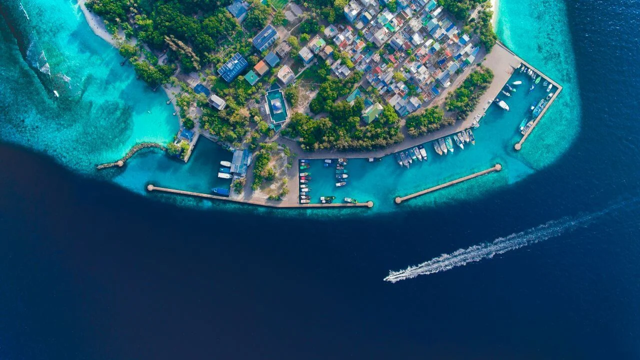 Aerial view of luxury resort in the Maldives showcasing overwater villas