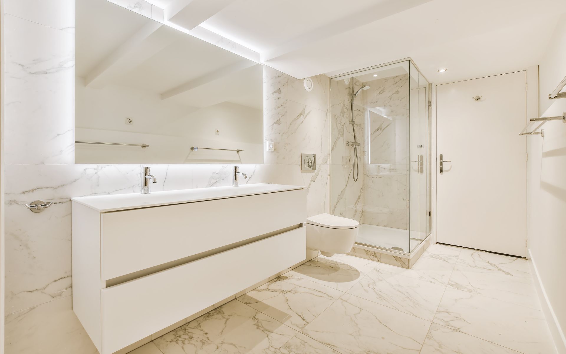 Modern bathroom remodel with white floating vanity double sinks freestanding tub and glass shower door