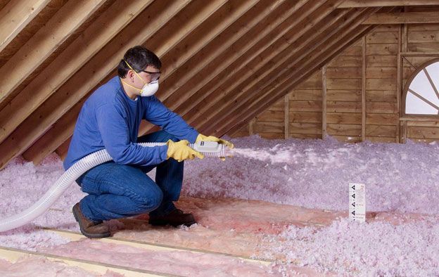 Professional attic insulation installation blown-in cellulose fiberglass spray foam energy efficient savings R-value