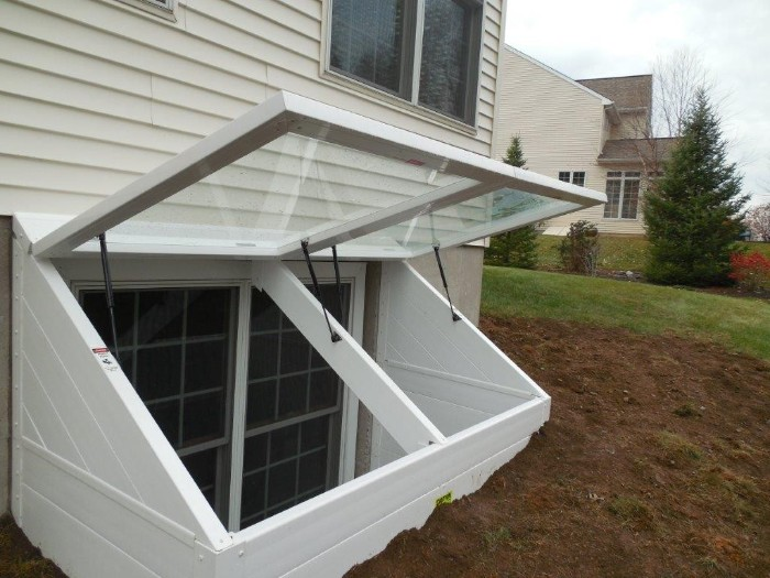 Professional basement egress window installation with window well emergency exit legal bedroom requirement safety