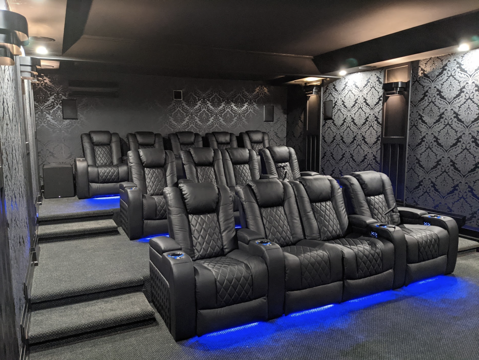 Professional basement home theater cinema conversion projector screen surround sound theater seating entertainment