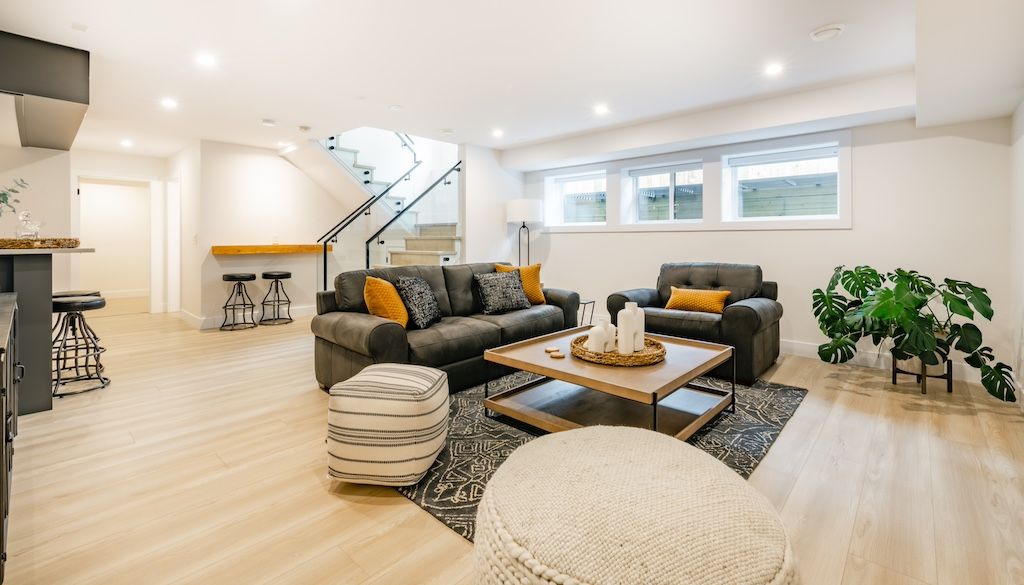 Professional finished basement remodel with family room living space modern design lighting