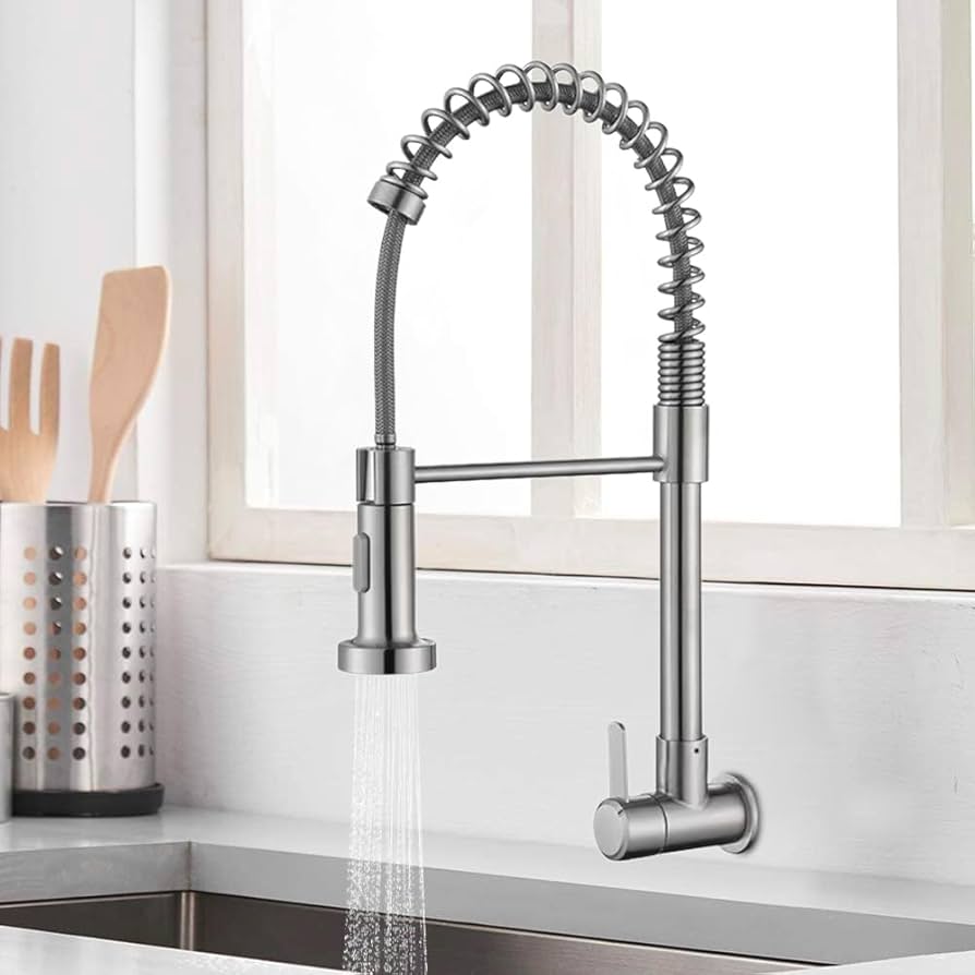 Professional kitchen faucet installation with pull-down sprayer stainless steel finish and proper plumbing connections