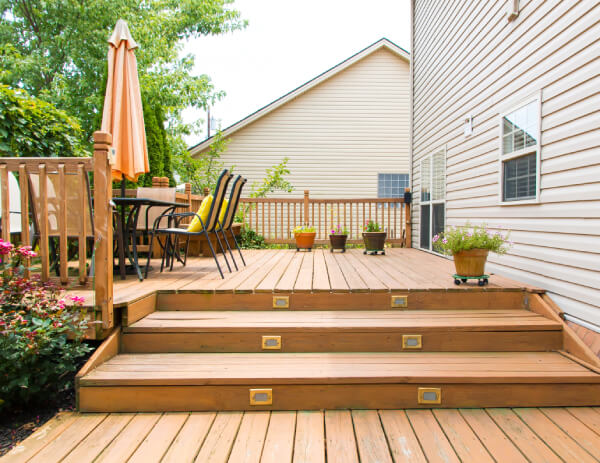 deck resurfacing cost guide 2026 deck resurfacing cost per square foot replace deck boards only composite overlay over wood pvc decking overlay deck tiles snap together rubber vinyl waterproof membrane system wood sanding staining refinishing deck restore coatings thick textured resurfacer average deck 400 sq ft resurfacing cost 4000 to 6000 save 40 to 60 percent vs new deck structural assessment required joists beams posts must be sound rot inspection probe test joist spacing 16 inch on center sleeper system raises deck height 1 to 2 inches stair tread replacement cost per step railing resurfacing cost per linear foot flashing installation ledger board protection fastener upgrade nails to screws substructure coating drainage improvements before and after deck makeover