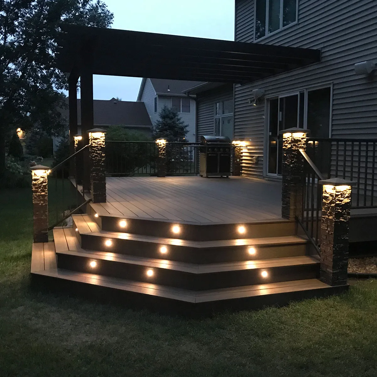 professional deck lighting installation low voltage led stair riser lights under rail led strips post cap lights recessed deck lights code compliant gfci weatherproof ip65 outdoor electrical safe wiring contractor quality evening deck ambiance