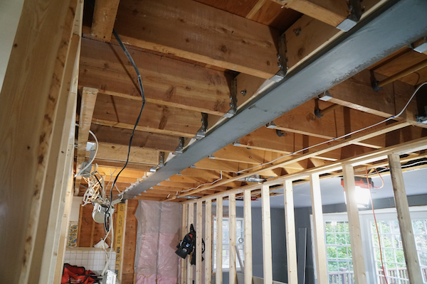 structural beam installation steel i beam lvl glulam temporary shoring bearing pockets engineered connections inspection residential renovation