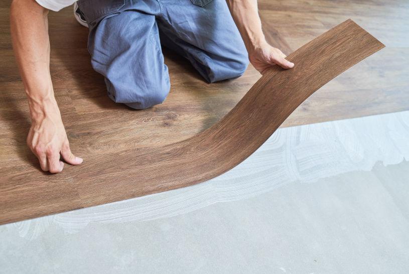 professional luxury vinyl plank flooring installation waterproof rigid core spc click lock planks level subfloor underlayment modern home durable rental friendly