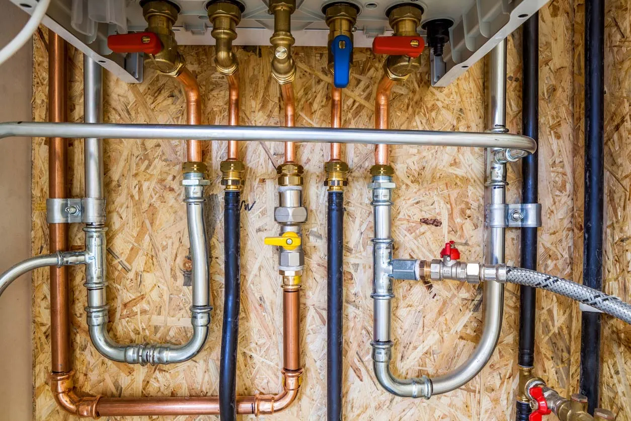professional whole house repiping installation pex copper cpvc supply lines manifold system shut off valves code compliant licensed plumber open walls clean organized plumbing upgrade